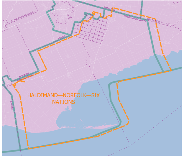 A map with an irregular shaped orange border around the title: Haldimand &ndash; Norfolk &ndash; Six Nations. A blue border, labeled Electoral Boundary Commission Proposal, somewhat duplicates the other border although offset.